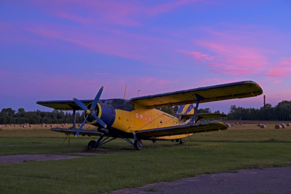 Evening Landscape with an Airplane