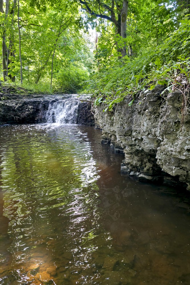 Valdatu Waterfall and Dolomite Outcrops in the Forest