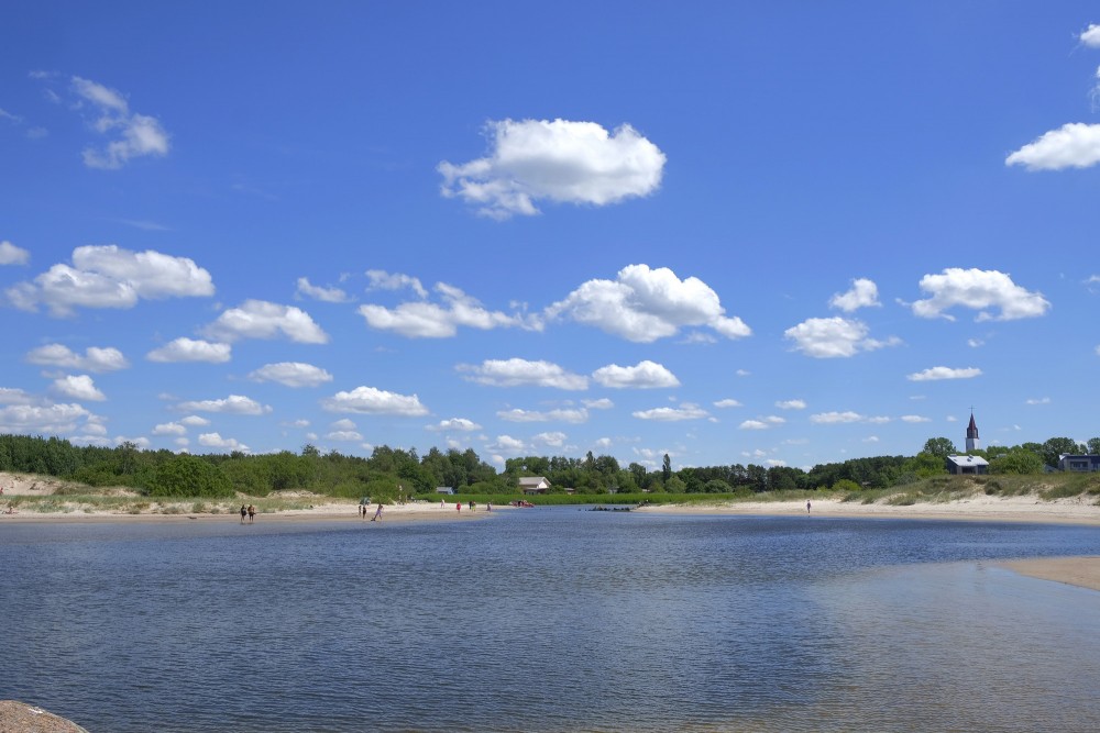 Sventoji river mouth at the sandy sea beach Sventoji river mouth at the sandy sea beach