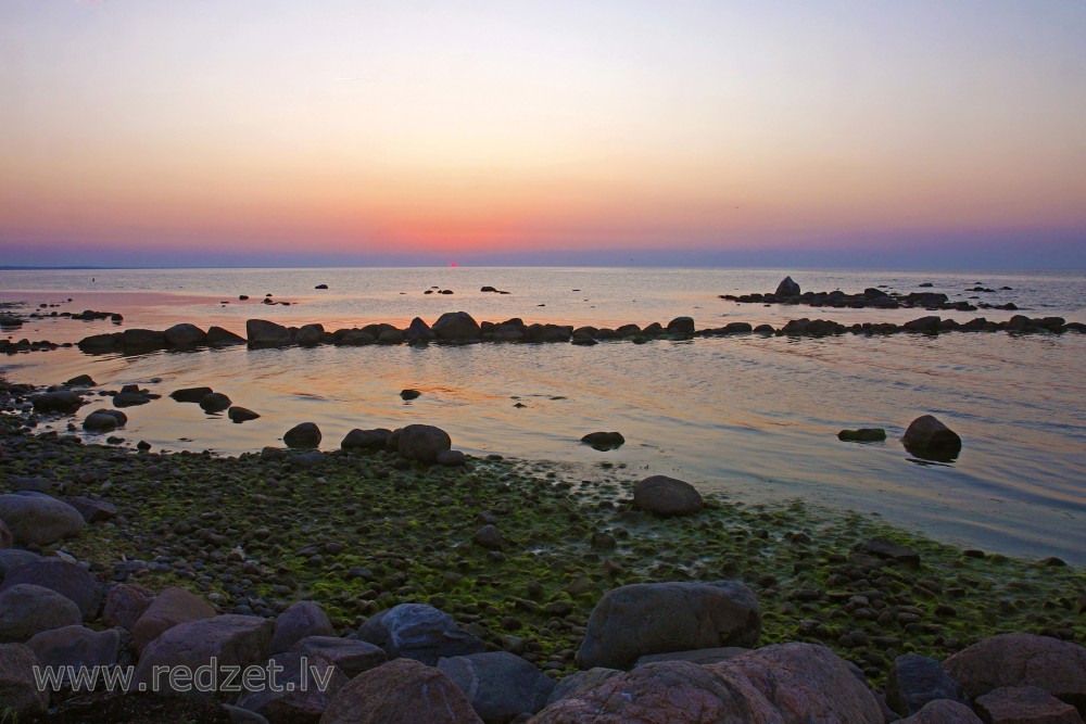 Sunset at the shore of the Baltic Sea in Mersrags, Latvia