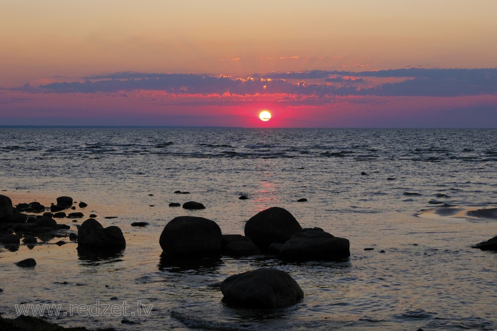 Sunset at stony shore in Mersrags, Latvia