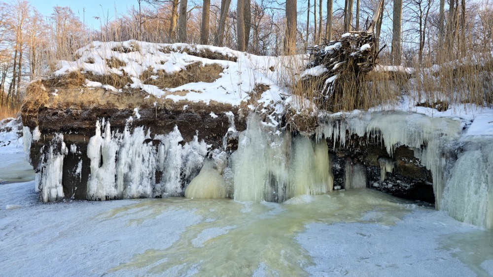 Frozen Staldzene bluff with icicles and snow