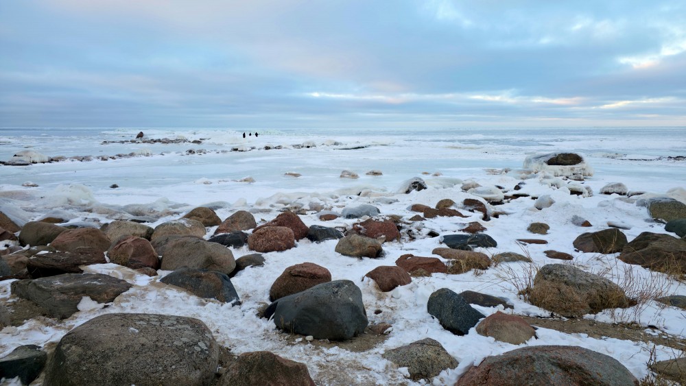 View of the frozen sea shore and rocky Mērsrags beach