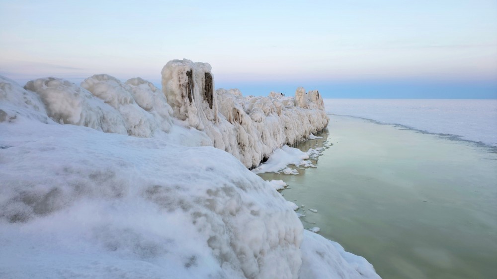 Ice walls and frozen sea at Engure breakwater