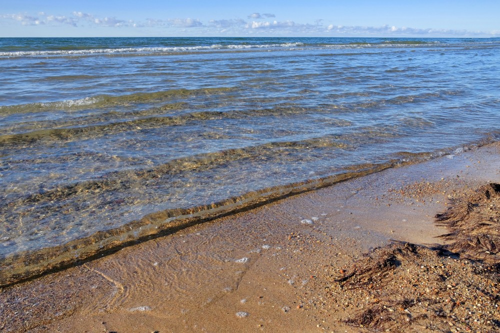 Crystal Clear Baltic Sea Waves on Sandy Shore Crystal Clear Baltic Sea Waves on Sandy Shore