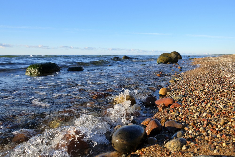 Rocky seaside shoreline on a calm sunny day