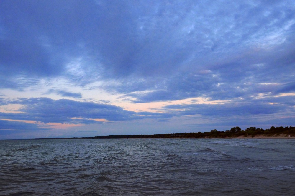 Rippling sea at twilight hour under cloudy skies Rippling sea at twilight hour under cloudy skies