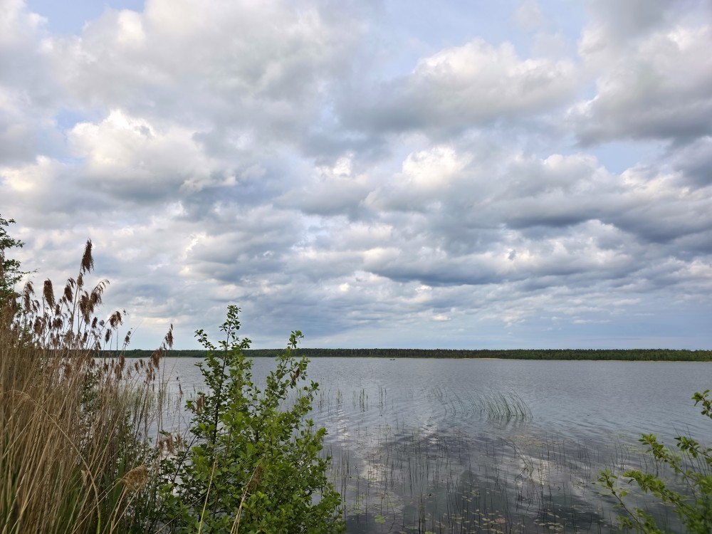 Landscape of Lake Būšnieki, cloudy sky