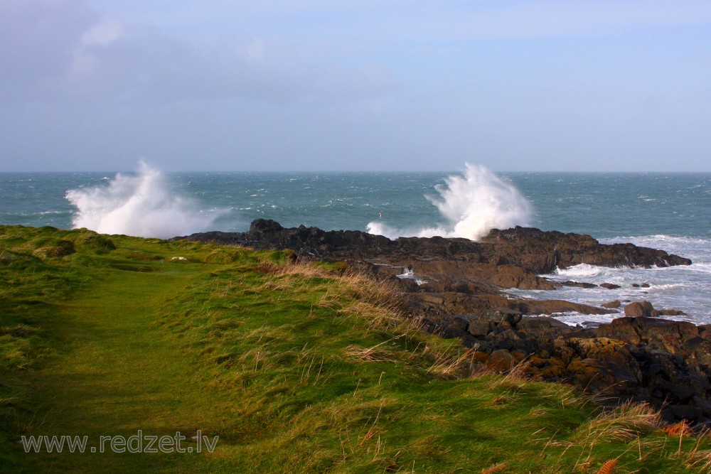 Waves Hit the Rocks