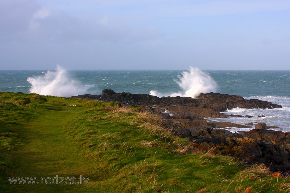 Waves Hit the Rocks