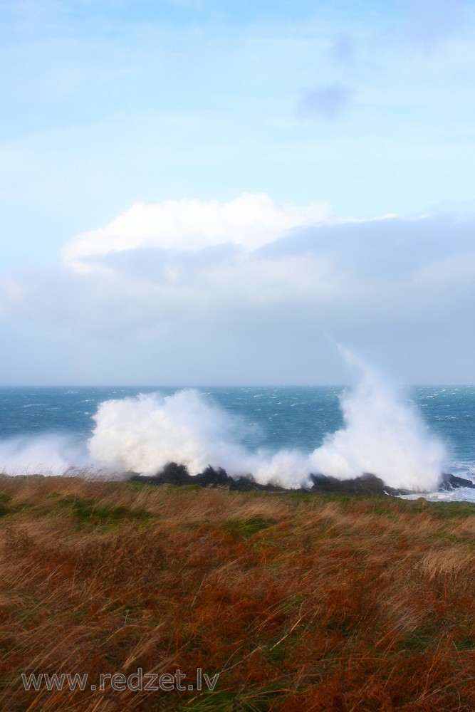 Waves Hit the Rocks