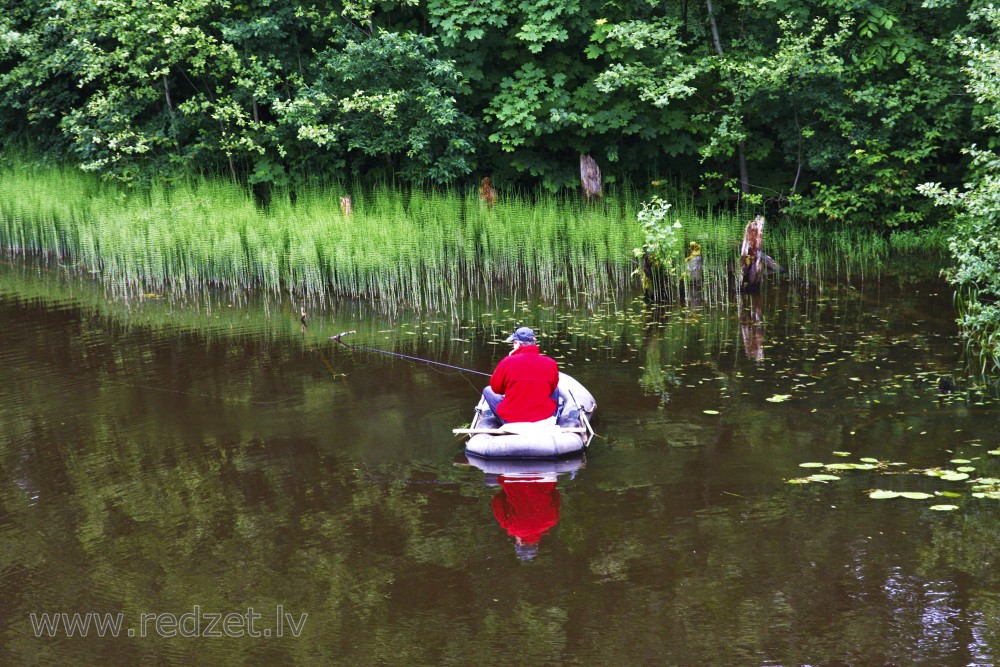 An Angler in an Inflatable Boat