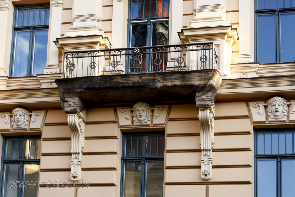 Fragment of the Building with a Decorative Balcony