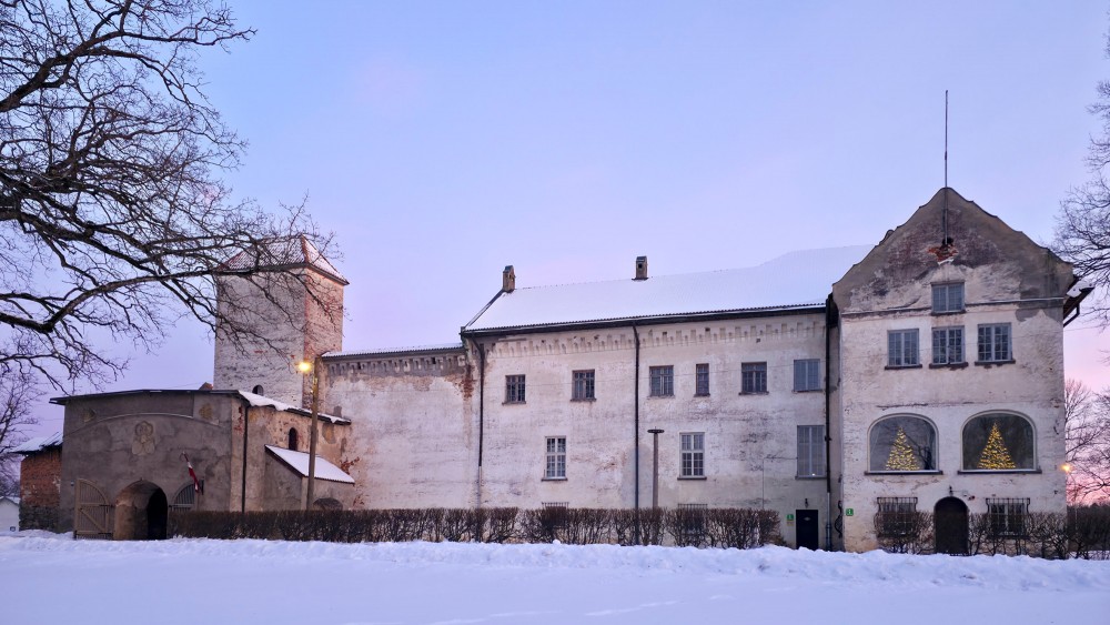 Dundaga Castle on a winter evening with tower, gate and snowy courtyard