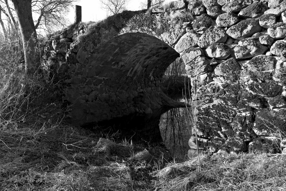 Mūrmuiža Arched Stone Bridge over River Vilce (black and white photo)