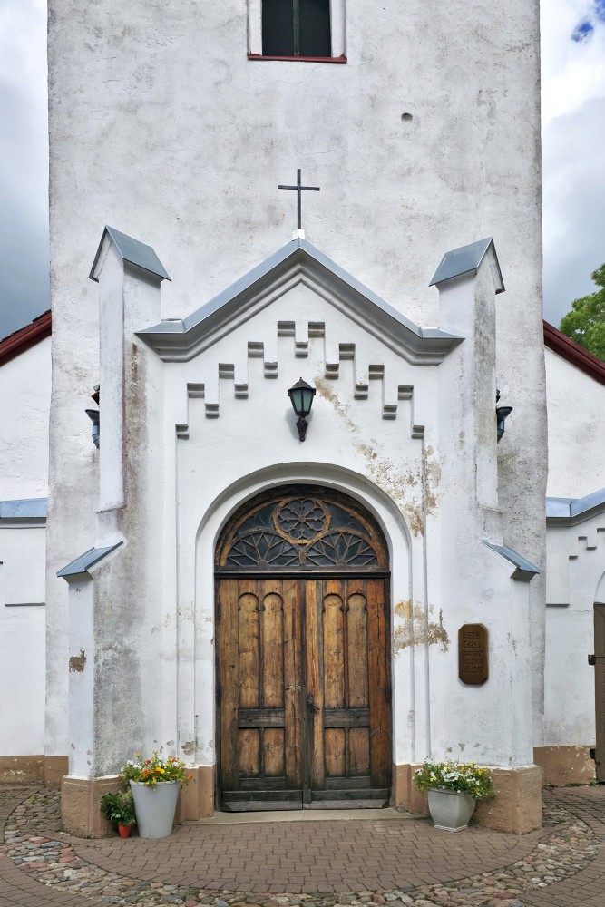 Wooden entrance door and decorative portal of Talsi Lutheran Church