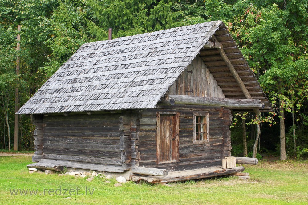 Old log house in the Vienkoču Park