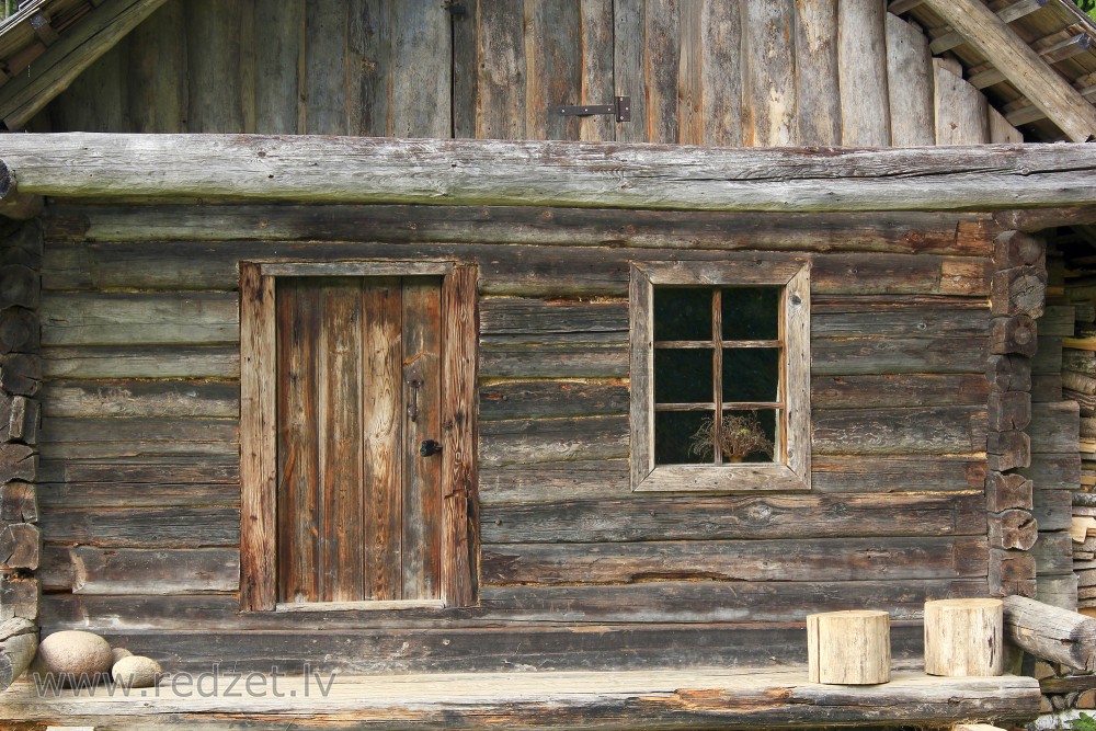 Old log house in the Vienkoču Park