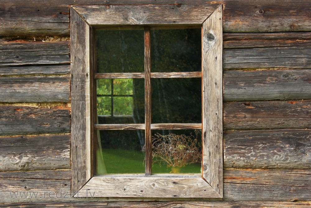 Window of old log-house in the Vienkoču Park
