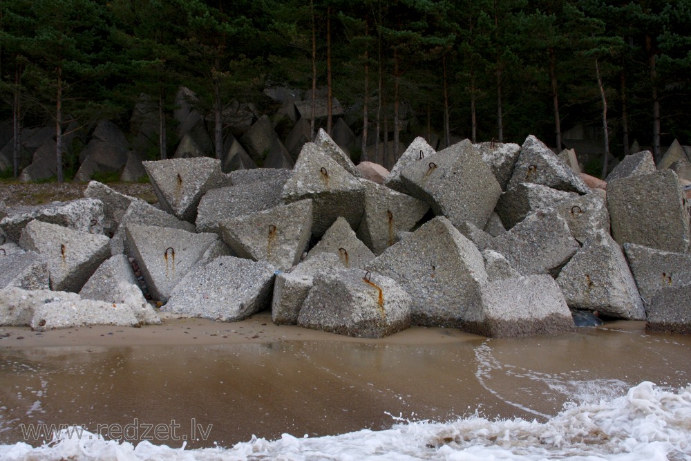 Breakwater made of concrete cubes near Užava Lighthouse