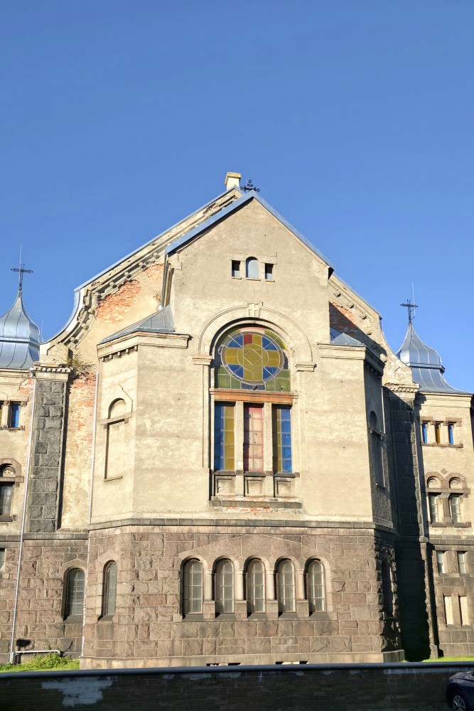 Liepaja Luther Church facade with a colorful circular stained glass