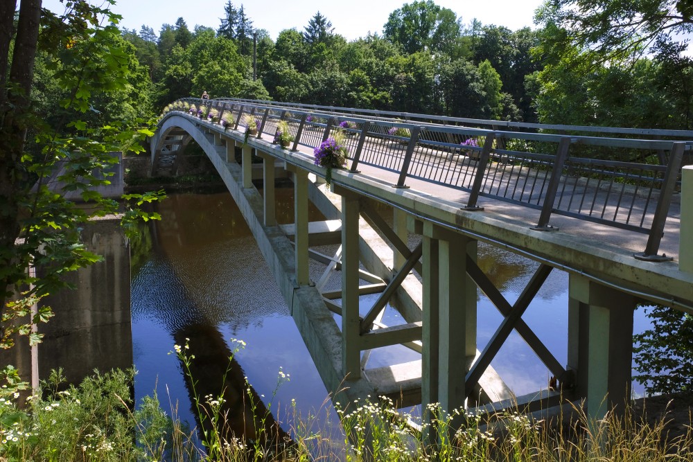 Arched Pedestrian Bridge over the Ogre River