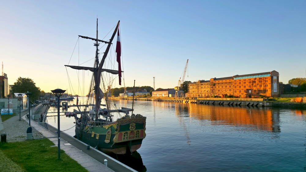 Sailing Vessel Libava Moored Opposite Historic Red Brick Warehouse