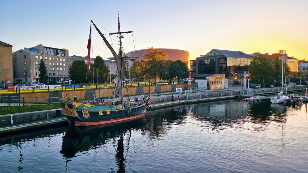 Sailing Vessel Libava in Trade Canal with Great Amber Concert Hall Silhouette