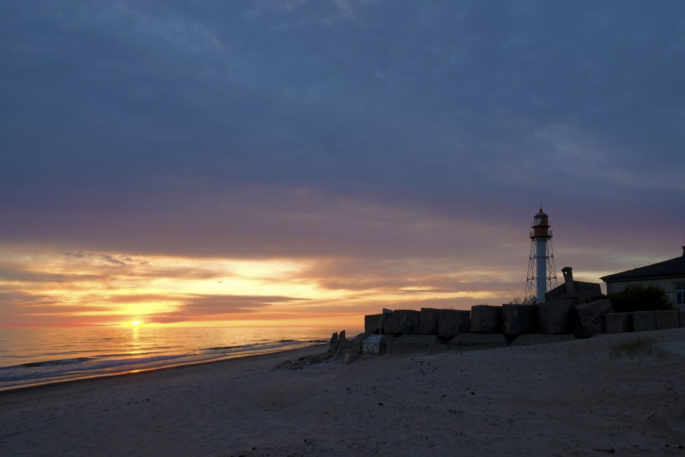 Pape Lighthouse At Sunset
