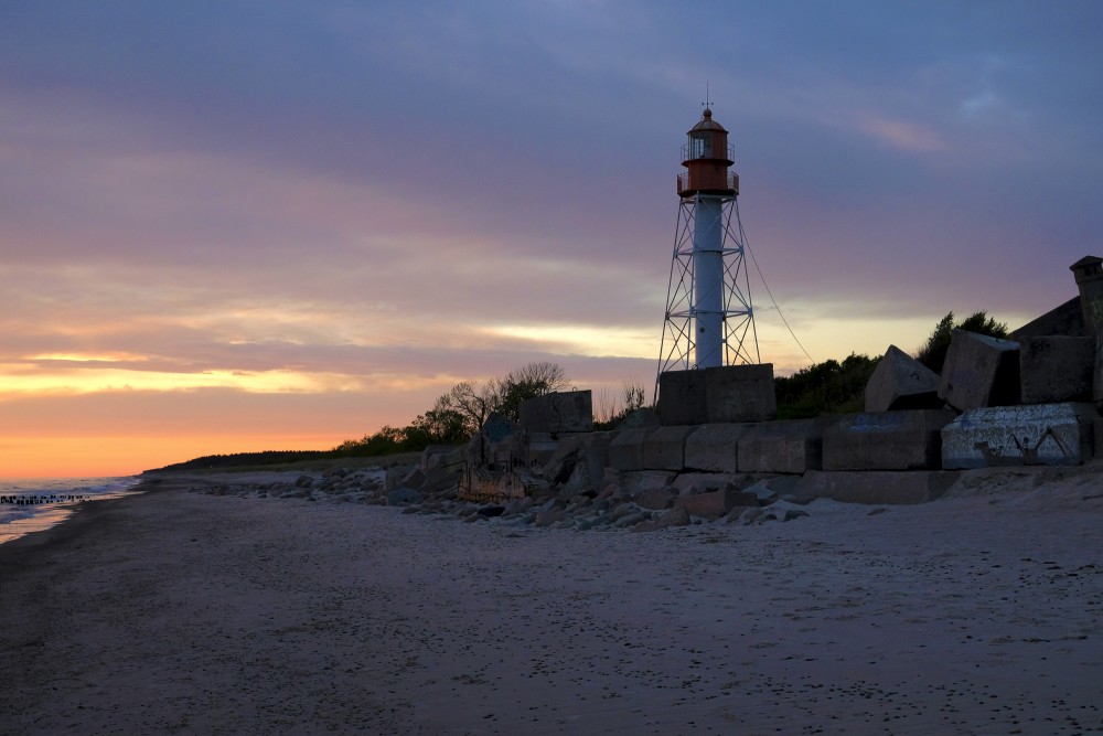 Pape Lighthouse At Sunset