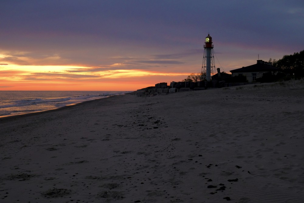 Pape Lighthouse At Sunset