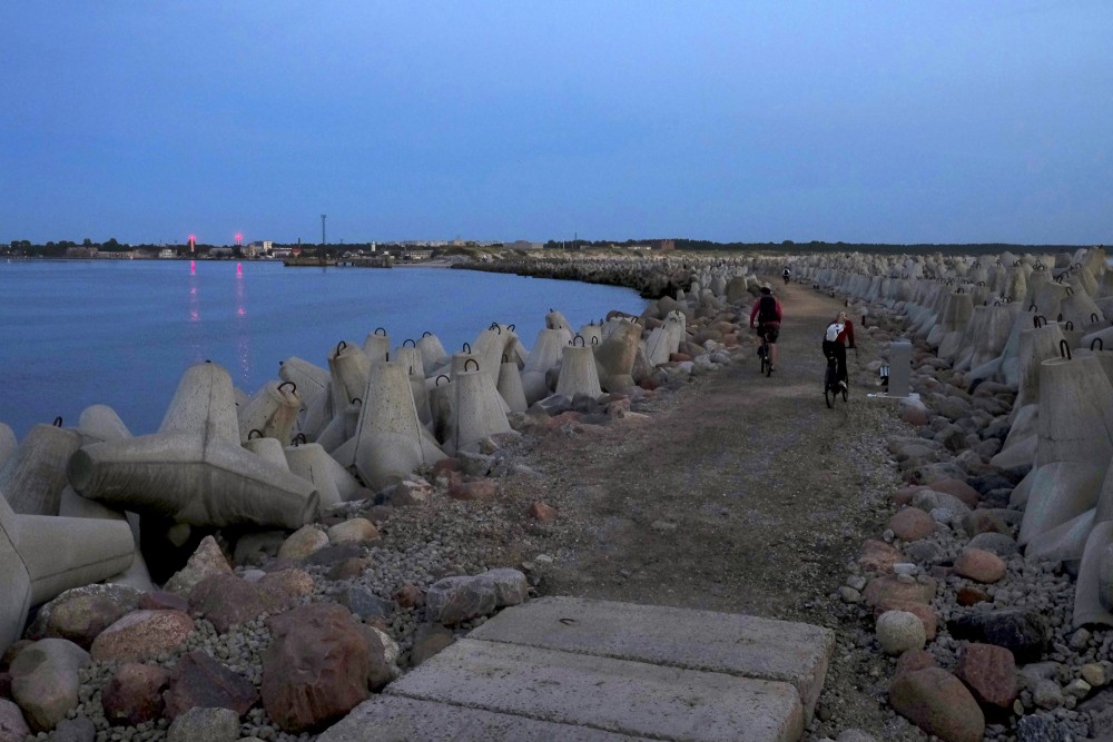 Evening view of Ventspils Southern Pier with cyclists