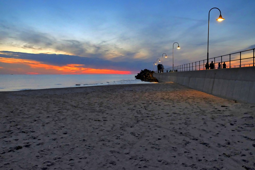Saulriets pie Ventspils Dienvidu mola ar izgaismotu promenādi