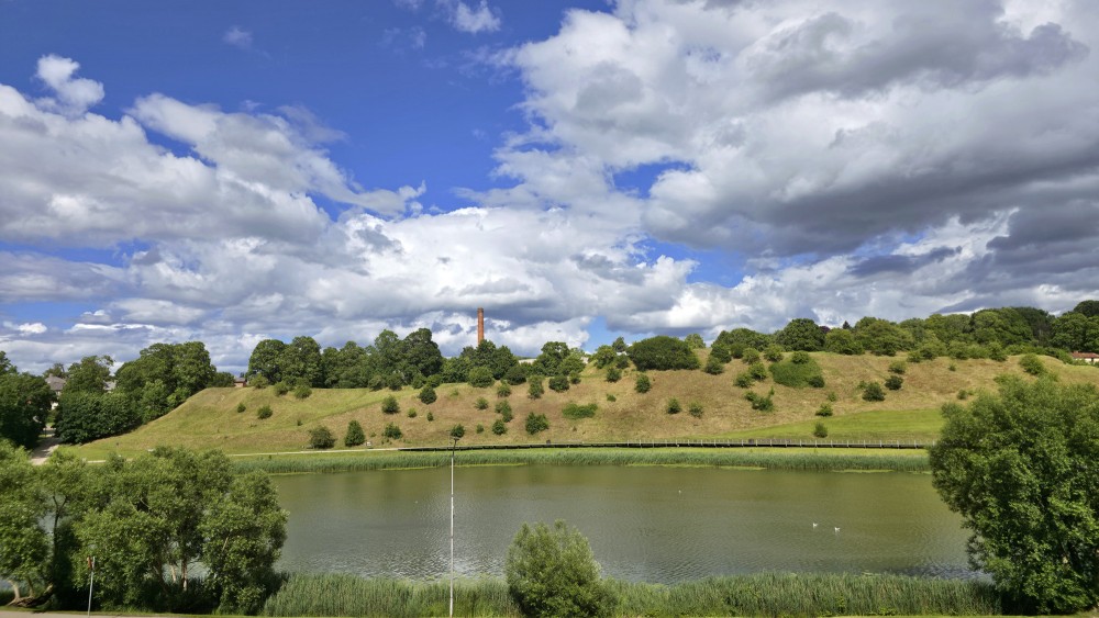 View of Talsi hillfort across Talsi lake in summer
