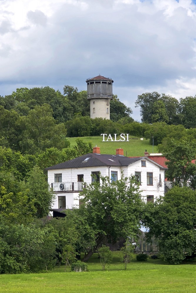Talsi town sign and water tower on the hill