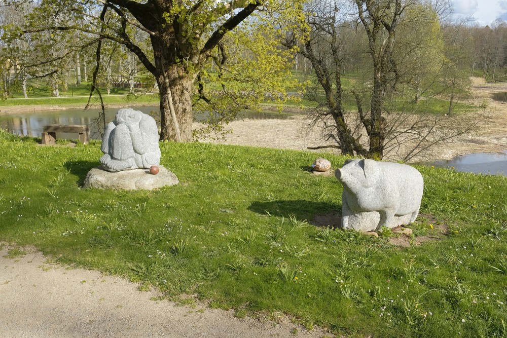 Fairy figures carved in stone - a shepherd, a black boar and a frog (Dundaga)