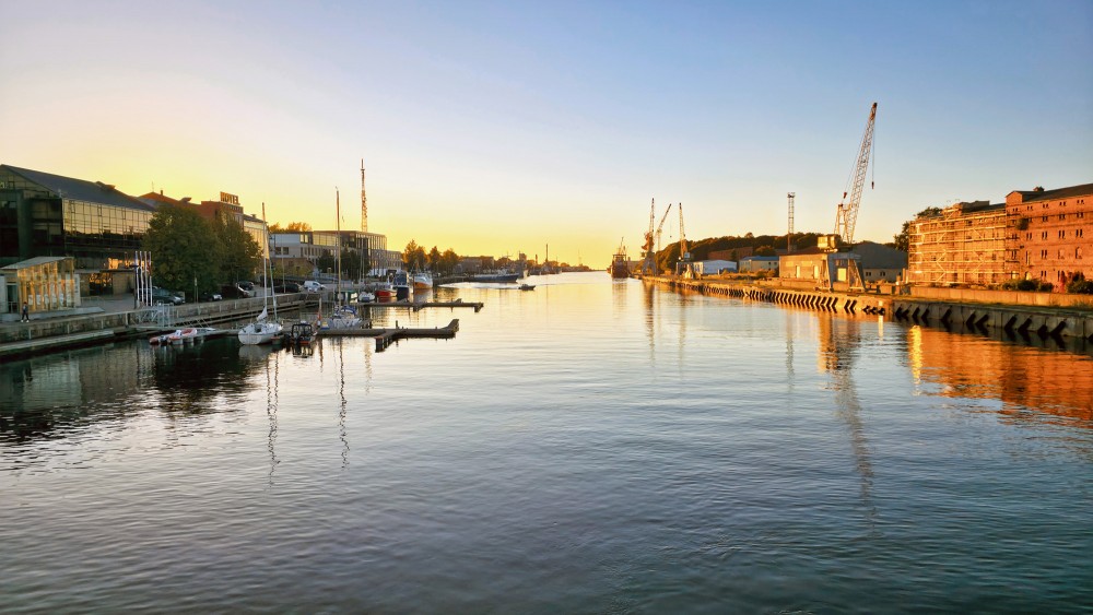 Panoramas View of Liepaja Trade Canal at Sunset with Harbour Cranes