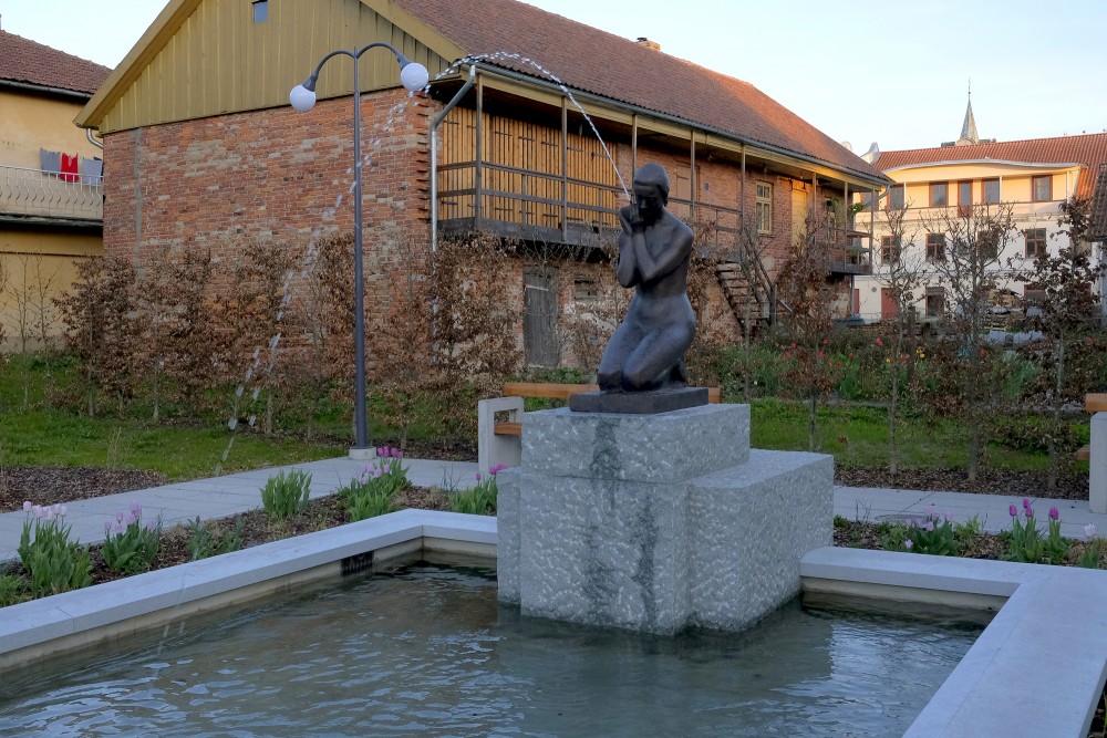 Girl with a cup of water (Kuldīga)