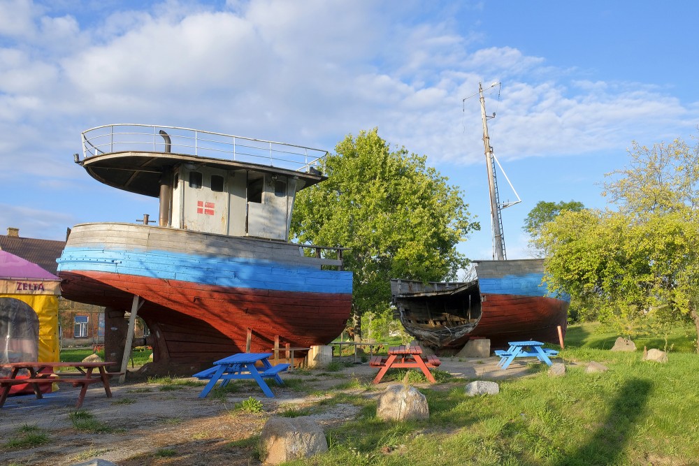 A halved wooden fishing boat as a tourist attraction in Pavilosta A halved wooden fishing boat as a tourist attraction in Pavilosta