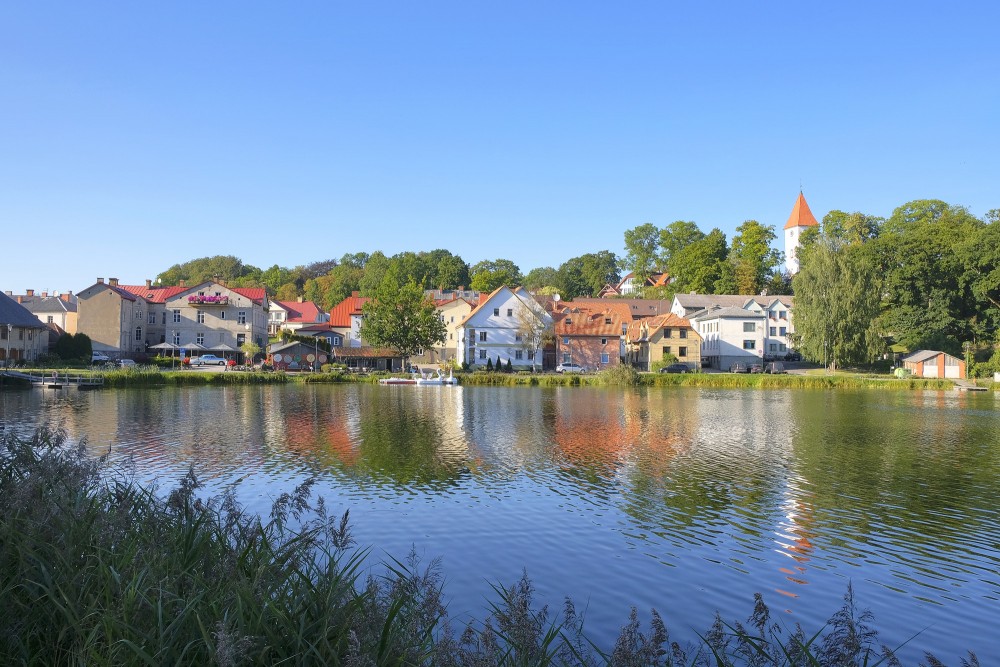 Reflection of Talsi town buildings in Talsi lake water