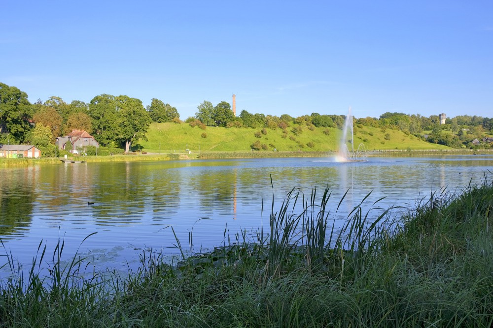 Talsi lake fountain and the green castle mound hill Talsi lake fountain and the green castle mound hill