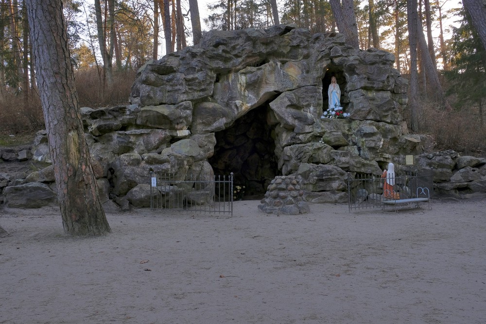 Lourdes Grotto of Palanga Manor with a stone cave and Virgin Mary statue
