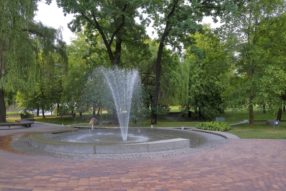 Round fountain and paved plaza in Marijampole Poetry Park