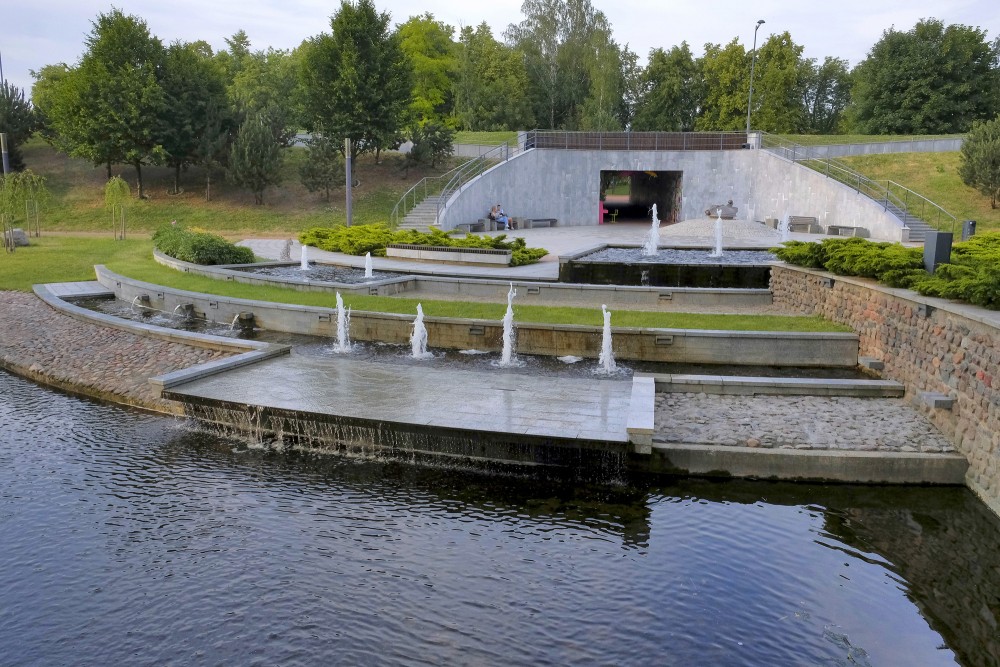 Cascading fountain and water body in Marijampole Poetry Park