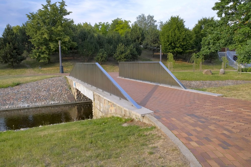 Pedestrian bridge over a canal in Marijampole Poetry Park