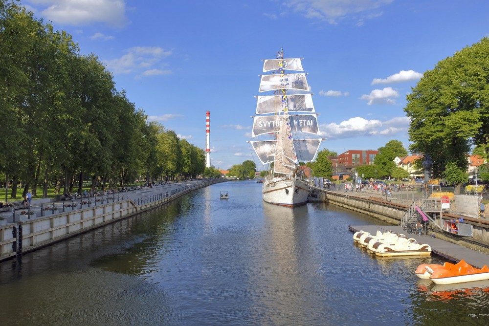 Sailing ship Meridianas and Dane river promenade in Klaipeda