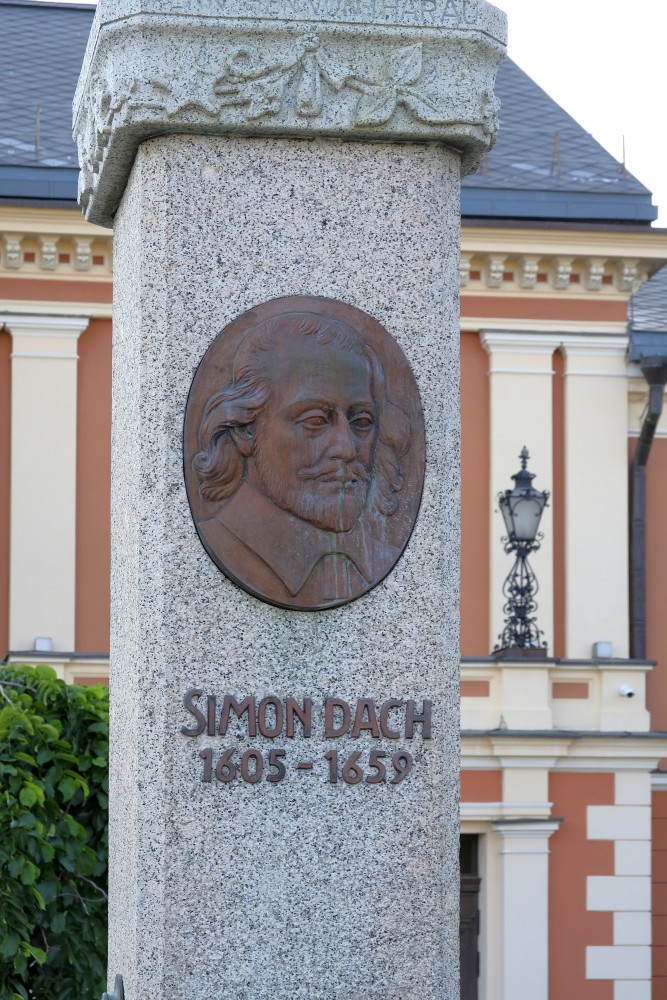 Simon Dach relief medallion and inscription on monument in Klaipeda