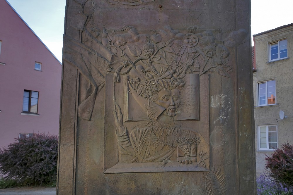 Close-up of bronze relief and engravings of The Tower sculpture in Klaipėda