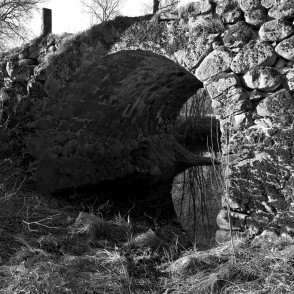Mūrmuiža Arched Stone Bridge over River Vilce (black and white photo) Mūrmuiža Arched Stone Bridge over River Vilce (black and white photo)